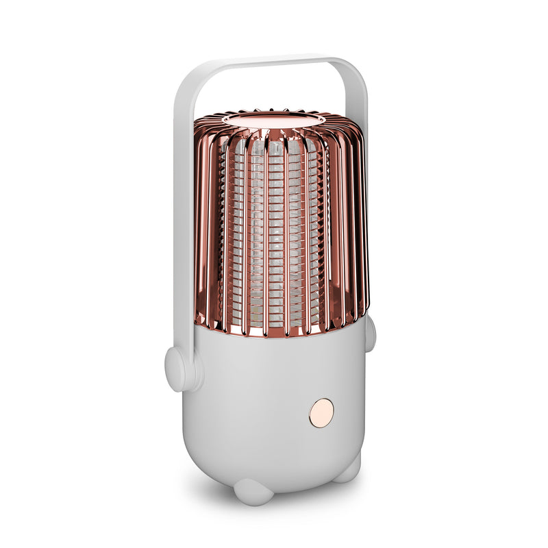 Portable mosquito lamp with rose gold top and white base on a white background